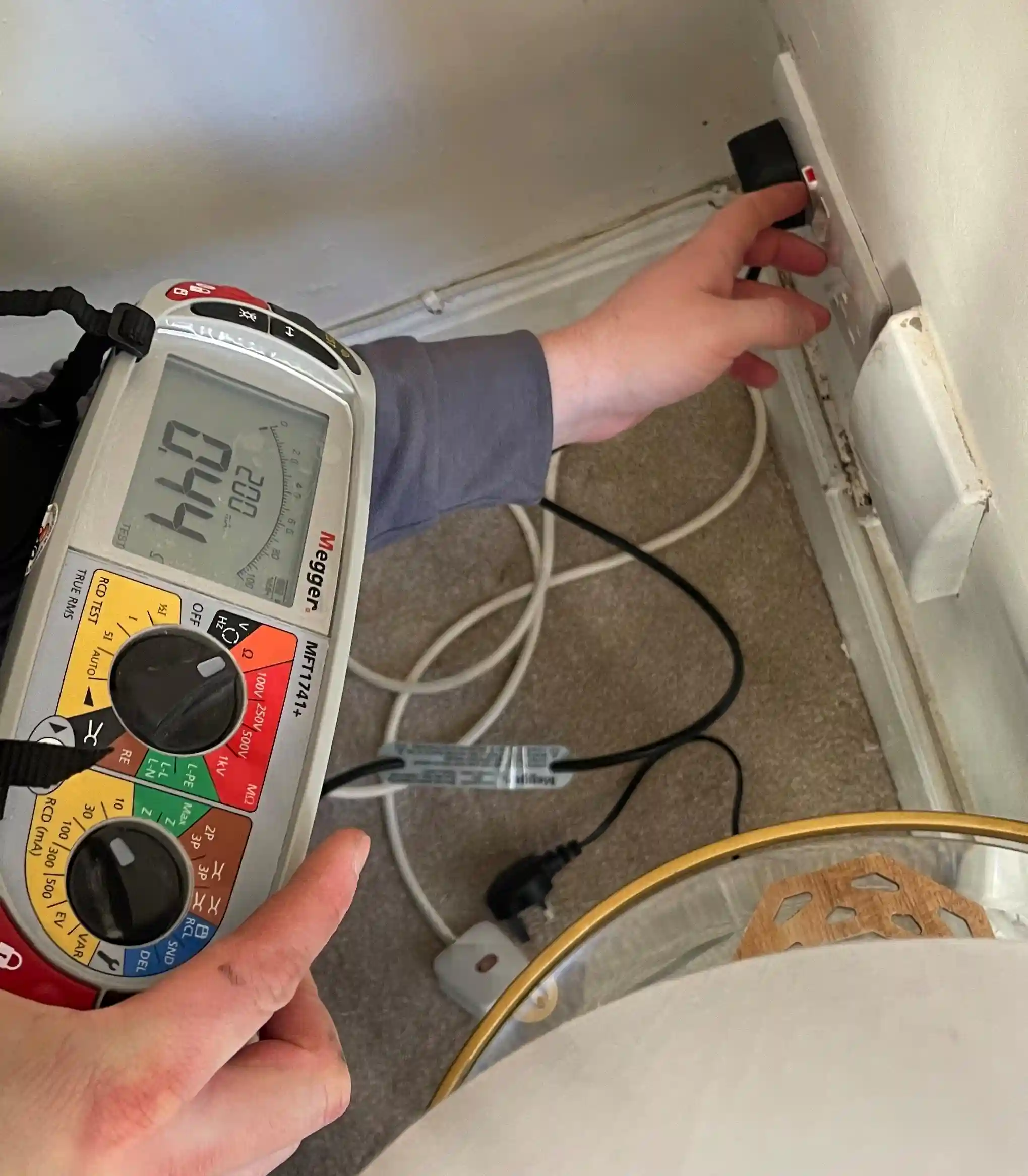 Photo of testing equipment being used to find faults in mains power.